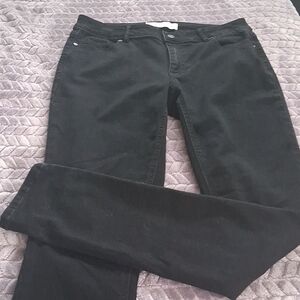 Black mid rise stretch jeans.